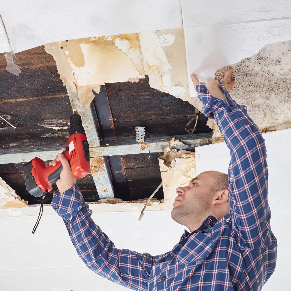 Water damage technician inspecting a Merritt Island, FL home